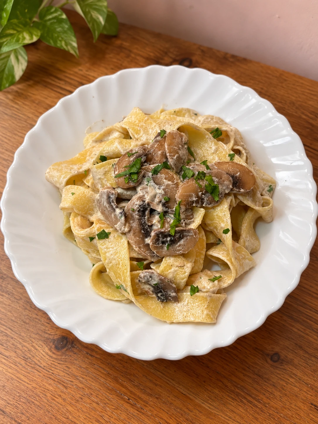 Pappardelle with a creamy mushroom sauce, garnished with parsley